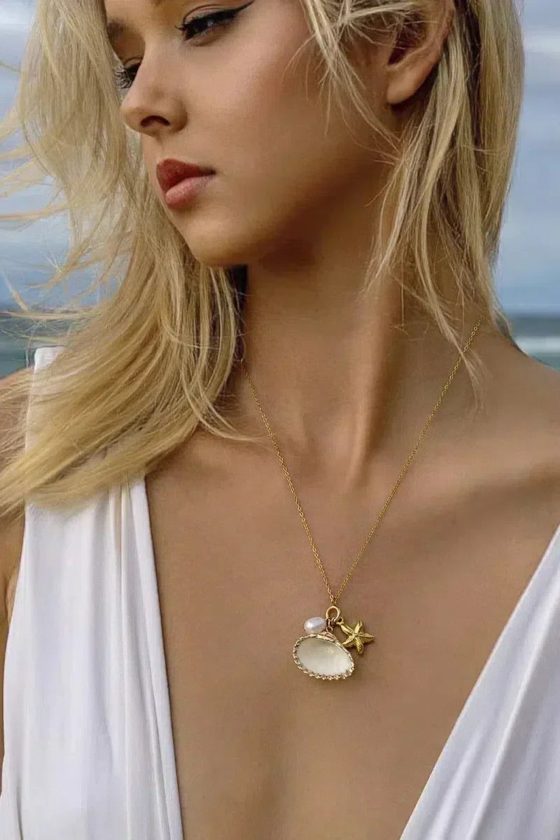 Ketting met zeester en parel - Speelse en zomerse uitstraling