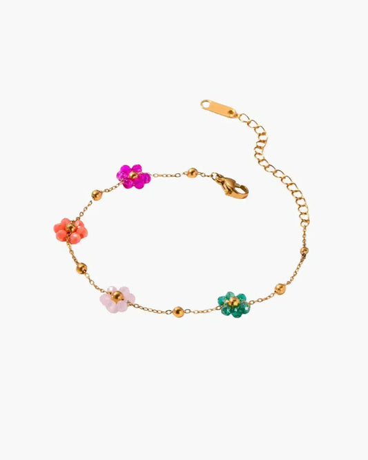 Goudkleurige bedelarmband met bloemenkralen - Verstelbare lengte